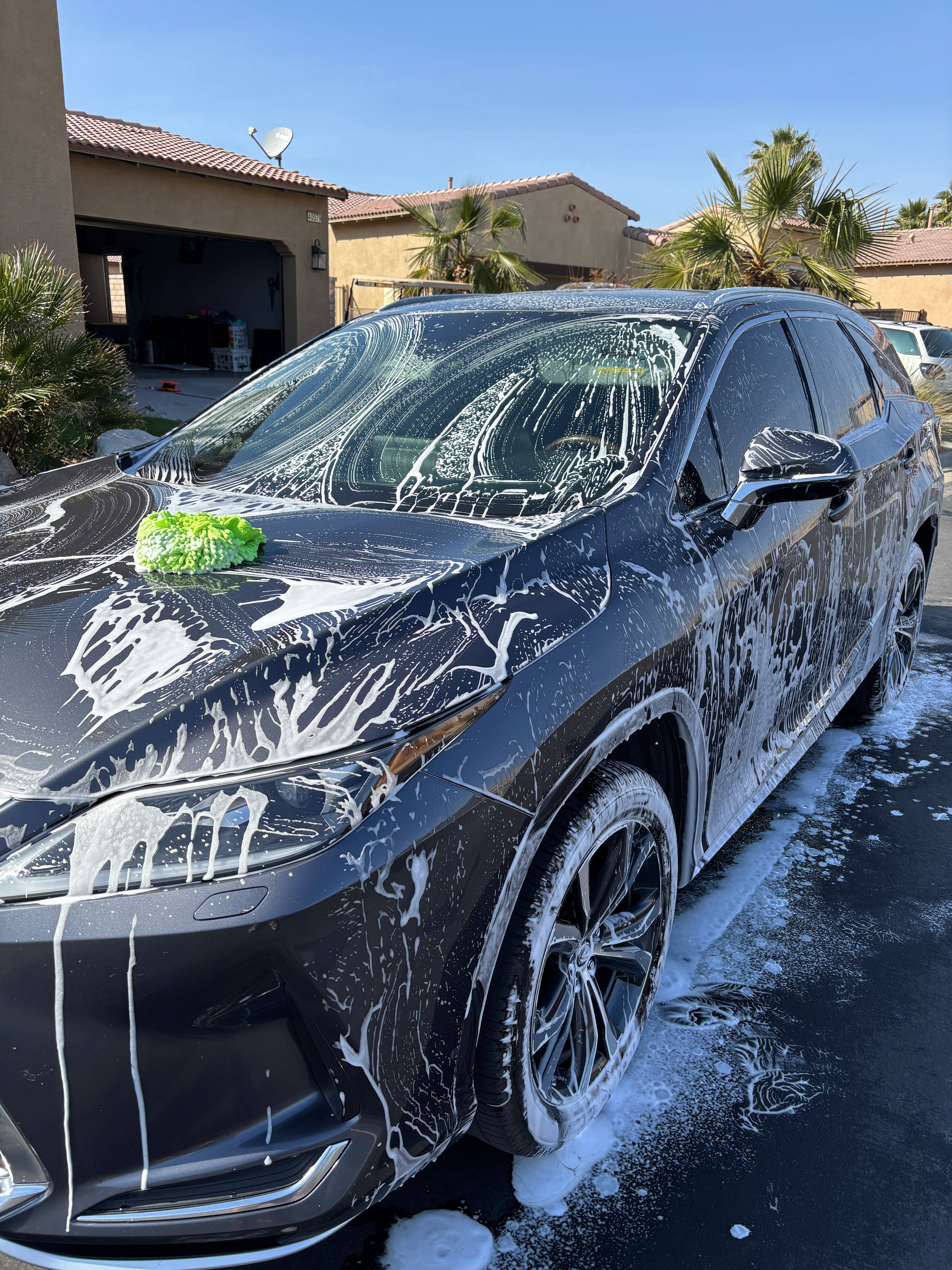 SUV covered in soap during wash process
